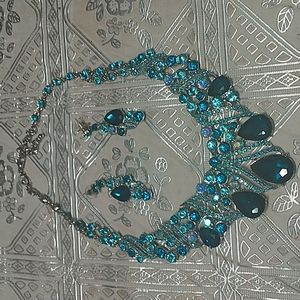 Lady necklace color blue silverish very pretty.